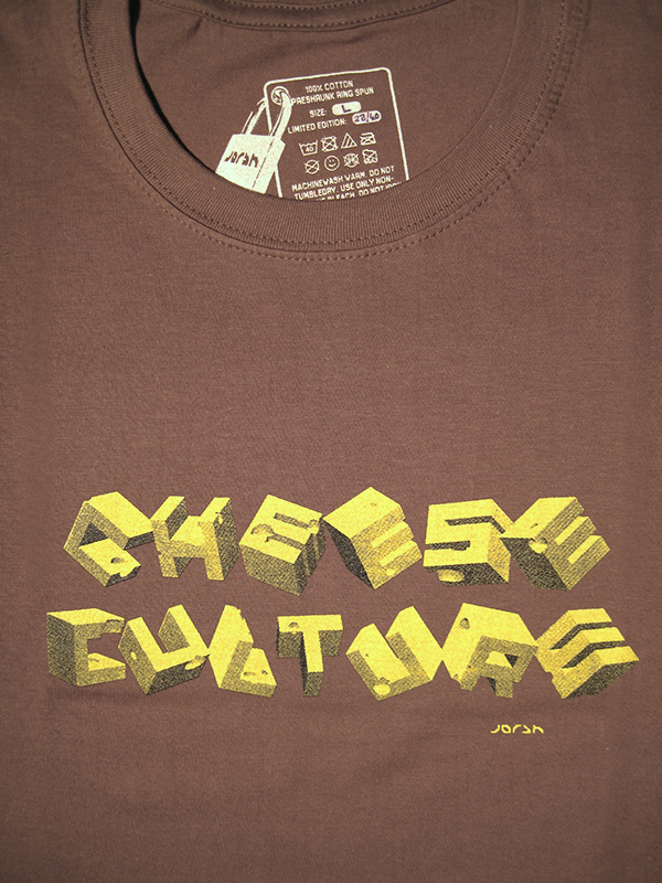 t-shirt with tumbling blocks of swiss cheese spelling the words cheese culture